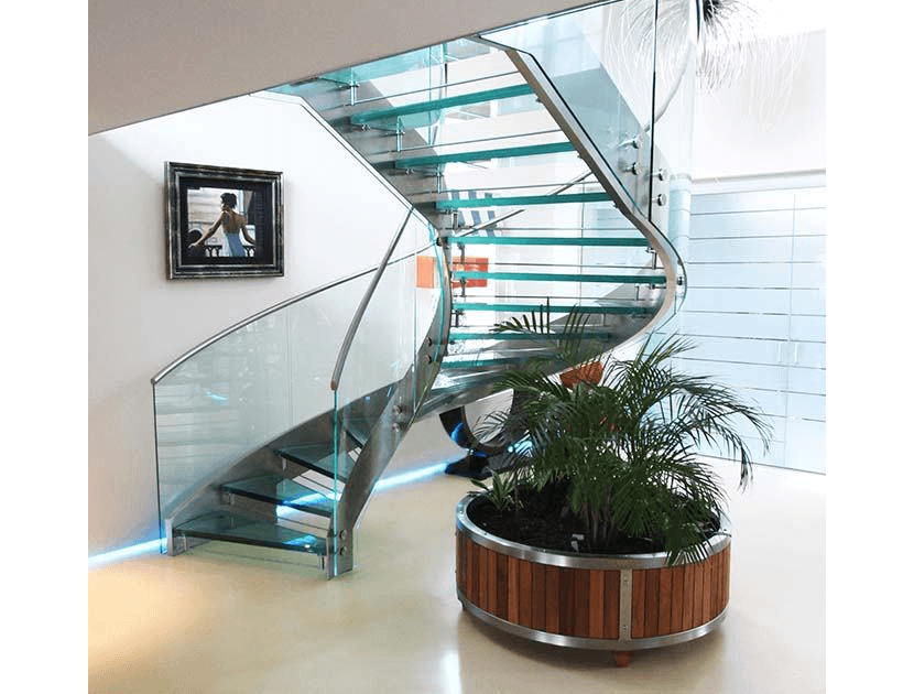 glass staircase next to plant