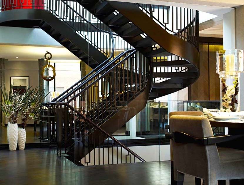 Helical staircase with leather handrail