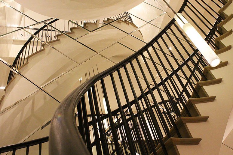 Curved-feature-staircase-mild-steel-balustrades