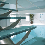 Centre spine stairs next to swimming pool